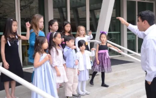 a group of children in dresses