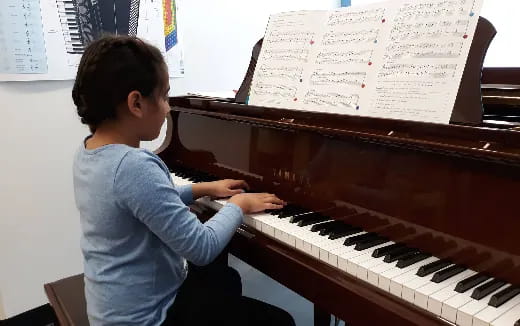 a child playing a piano