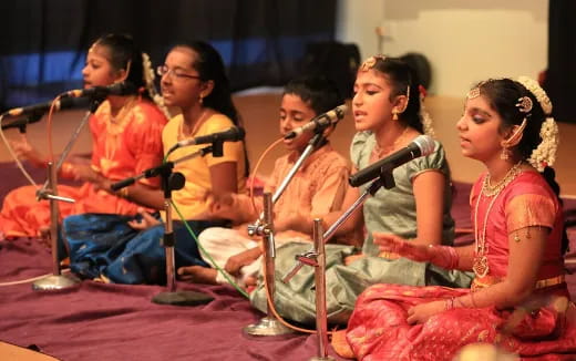 a group of women performing on stage