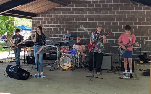 a group of people playing instruments