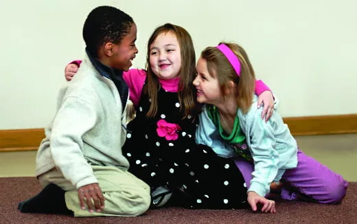 a group of children sitting on the floor