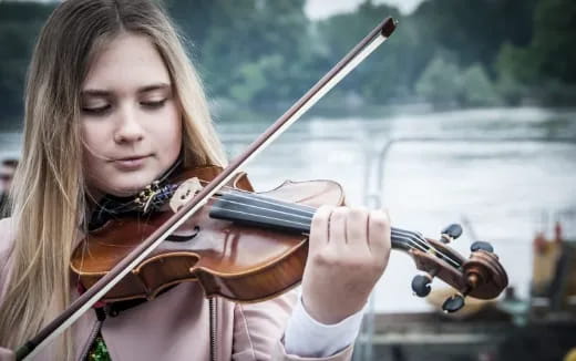 a person playing a violin