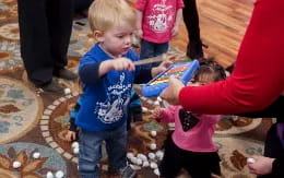 a group of children playing with toys