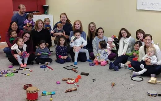 a group of people sitting on the floor