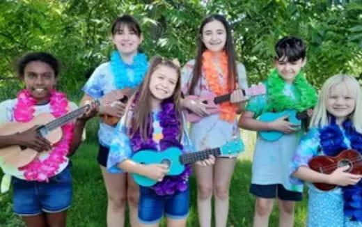 a group of kids holding instruments