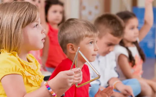 a group of children playing with a toy