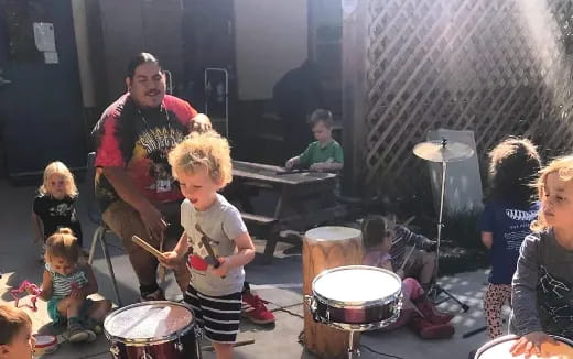 a group of people playing drums