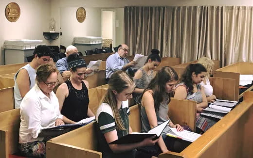 a group of people sitting in a church