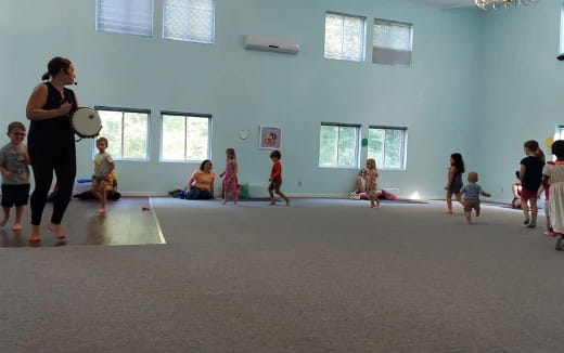 a group of people playing frisbee in a room
