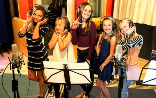 a group of girls posing for a photo