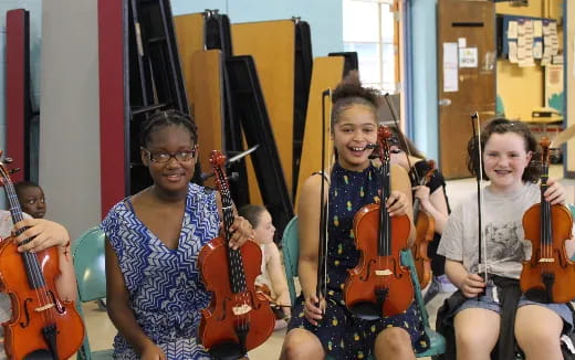 a group of kids playing instruments