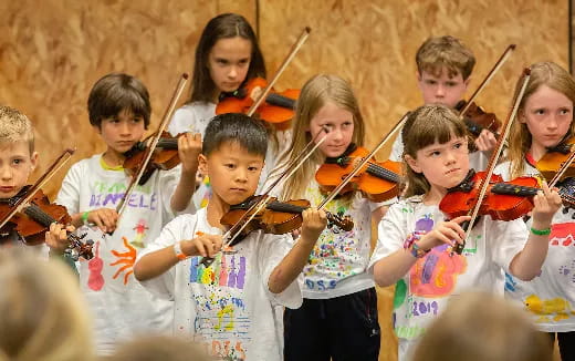 a group of children playing instruments