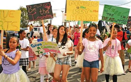 a group of people holding signs