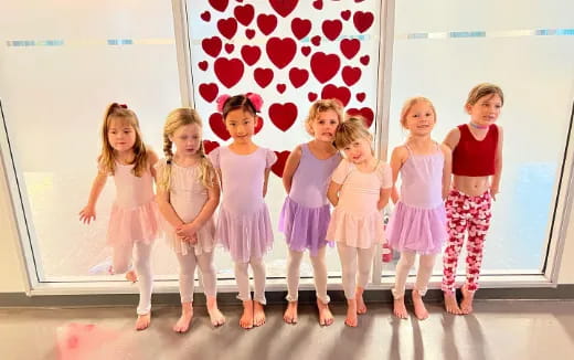 a group of girls posing for a photo