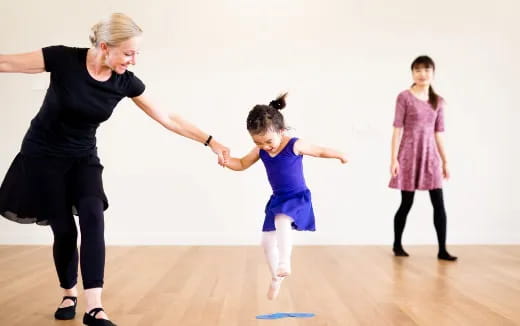 a person and a girl dancing