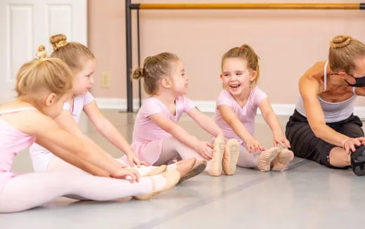 a group of children sitting on the floor