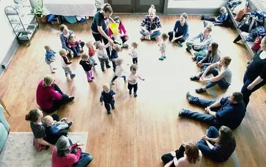 a group of people sitting on the floor