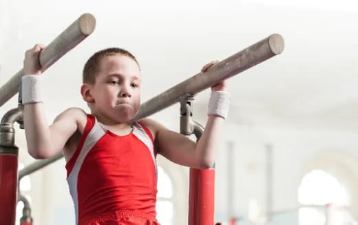 a boy holding a baseball bat