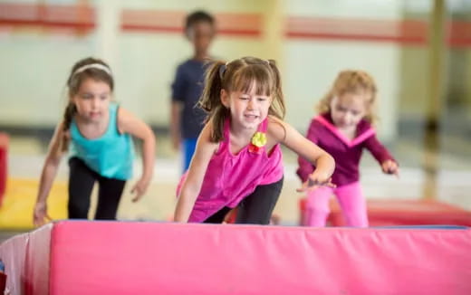 a group of children playing on a mat