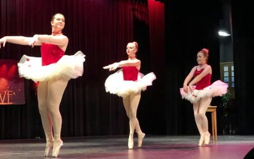 a group of women performing on a stage