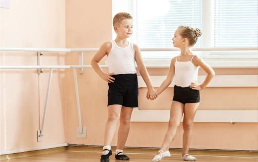 a boy and girl dancing