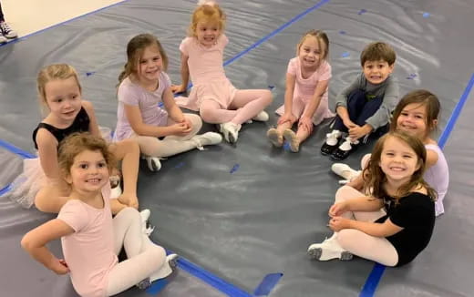 a group of children sitting on the floor