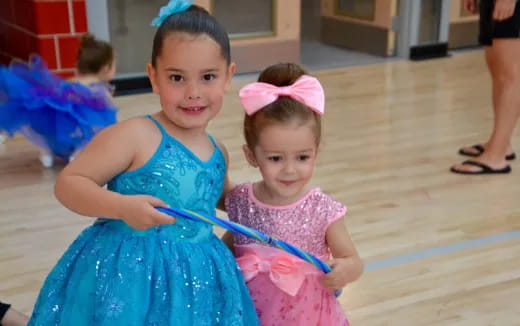 a couple of girls in dresses