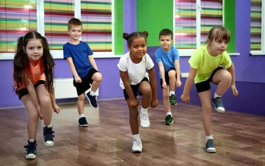 a group of kids in a gym