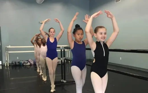 a group of girls in a dance class