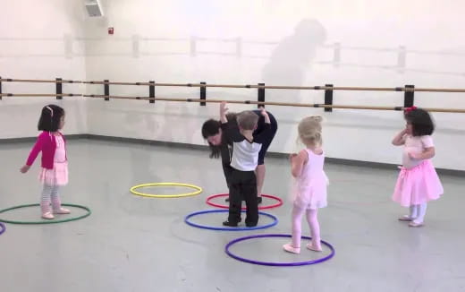 a group of children playing on rings