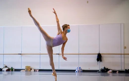 a woman doing a gymnastics trick