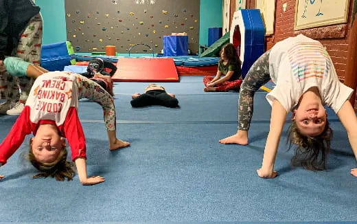 a group of girls doing yoga