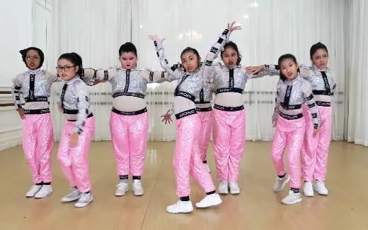 a group of children in karate uniforms