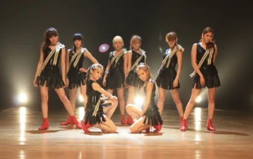 a group of women dancing on a stage