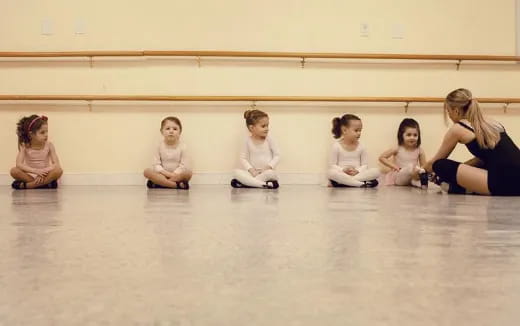 a group of children sitting on the floor