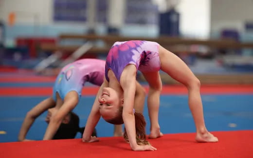 a couple of people doing push ups