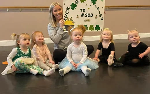 a group of children sitting on the floor