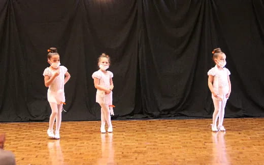 a group of girls on a stage