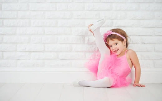 a baby in a pink dress