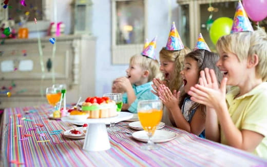 a group of people wearing party hats