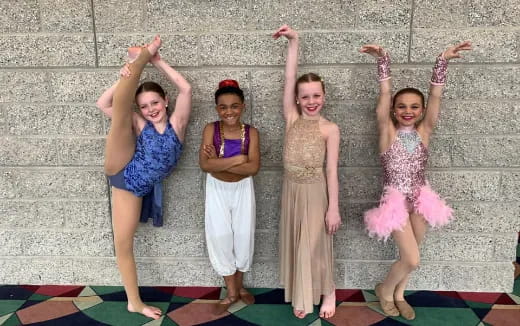 a group of girls posing for a photo