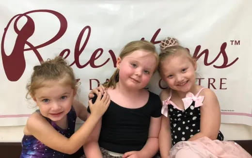 a group of girls posing for a photo