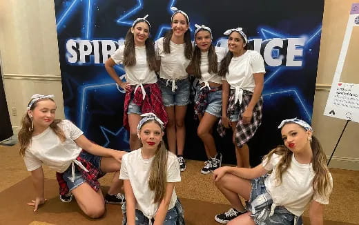 a group of girls posing for a photo