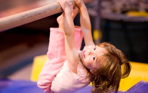 a girl doing a handstand