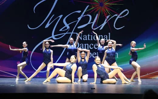 a group of women dancing on a stage