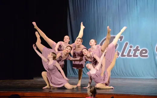 a group of women performing on a stage