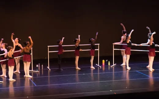 a group of girls performing on a stage
