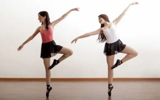 two women dancing on a stage