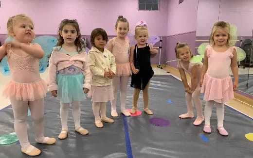 a group of girls posing for a photo