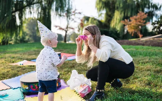 a person and a child eating candy